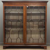 Large Georgian mahogany free standing bookcase, projecting cornice with dentil detail,