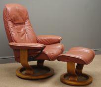 Stressless reclining armchair and stool, upholstered in maroon leather,