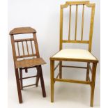 Child's or doll's mahogany stick back folding chair, with shaped bar back and X shaped frame,