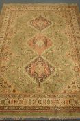 Persian style, green ground carpet, triple pole medallion,