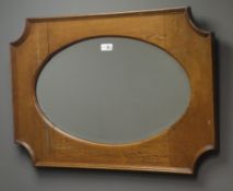 Early 20th century oak framed mirror, oval bevel edged plate, W80cm,