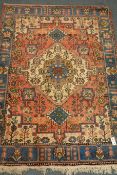 Persian red ground rug, blue border,