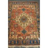 Persian red ground rug, blue border,