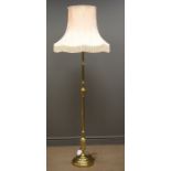 Brass standard lamp with pink lamp shade,