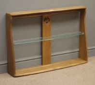 Ercol wall rack, centre support with carved and pierced swan, single glass shelf, W92cm, H62cm,