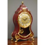 'Eluxa' French style mantel clock, cartouche shaped red lacquered and gilt decorated case,