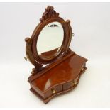 Carved swing frame toilet mirror on mahogany serpentine base with three fitted drawers,