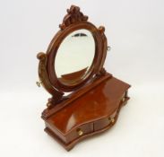 Carved swing frame toilet mirror on mahogany serpentine base with three fitted drawers,