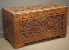 Heavily carved Eastern chest with wildlife and foliage, camphor wood lining on bracket supports,