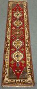 Persian red ground runner rug, 74cm x 295cm Condition Report <a href='//www.