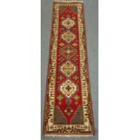 Persian red ground runner rug, 74cm x 295cm Condition Report <a href='//www.