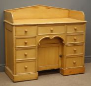 Victorian pine knee hole dressing table, raised shaped back, four short,