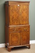 Quality reproduction figured mahogany serpentine cocktail cabinet, double cupboard above slide,