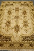 Louis De Poortere Mossoul Persian style green ground rug, central medallion,