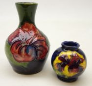 Moorcroft vase of bottle shaped form tube lined in the 'Hibiscus' pattern H9cm and a Moorcroft