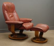 Stressless reclining armchair and stool, upholstered in maroon leather,