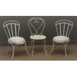 Three French wrought metal garden chairs,