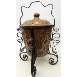 Art Nouveau embossed copper coal bin decorated with stylized flowers,