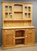 Pine dresser, projecting cornice, two shelves, flanked by two glazed cupboards,