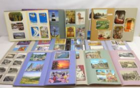 Three modern scrap albums containing loose mounted Edwardian and later postcards including some