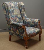 Victorian wingback armchair, upholstered in floral pattern fabric,