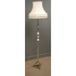 Cream finish standard lamp, reeded column, three splayed moulded supports,