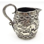 Early 20th century Indian silver jug, embossed with hunting scene,