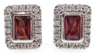 Pair of silver garnet and cubic zirconia ear-rings,