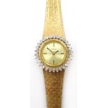 Baylor Swiss 9ct gold bracelet wristwatch, diamond set bezel 25.