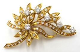 18ct gold diamond floral brooch, six principle diamonds and diamond set leaves stamped 750, 4.