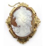 9ct gold cameo brooch with scroll and leaf design,