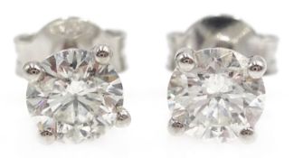 Pair of 18ct gold diamond stud ear-rings stamped 750 approx 1 carat Condition Report