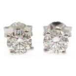 Pair of 18ct gold diamond stud ear-rings stamped 750 approx 1 carat Condition Report