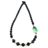 Carved jade, coral, black onyx and 18ct gold necklace