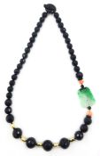 Carved jade, coral, black onyx and 18ct gold necklace