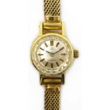 Lady's Omega 9ct gold bracelet wristwatch, sapphire crystal glass face,