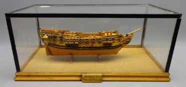 Wooden scale model of the 6th Rate Ship TM Whitehead de-rigged,on stand in perspex case, W54cm,