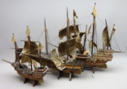 Three wooden models of three masted galleons, fully rigged with solid hulls,