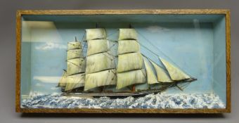 20th century naive Diorama of a three masted sailing vessel under full sail in a choppy sea,
