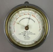 Circular metal cased 'Fishermans Aneroid Barometer' issued by the Royal National Life Boat