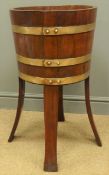 Edwardian coopered teak jardiniere, copper bound circular body on four outsplayed angular supports,