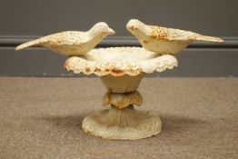 Small cast iron bird bath mounted with two sitting birds,