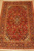 Kashan red ground rug, repeating border,