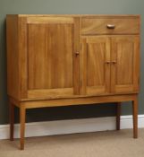 Craftsman made teak side cabinet fitted with three cupboards and single drawer,