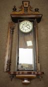 Late 19th century walnut cased Vienna wall clock, twin train movement striking on coil,