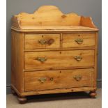 Early 20th century waxed pine washstand, raised shaped back and sides,