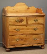 Early 20th century waxed pine washstand, raised shaped back and sides,