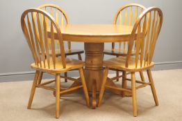 Oak circular dining table on turned column with four splayed supports (D107cm, H76cm),