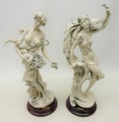 Two Giuseppe Armani figures of an Art Deco style woman with a Peacock and another holding flowers,