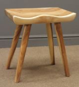 Hardwood saddle seat four legged stool,